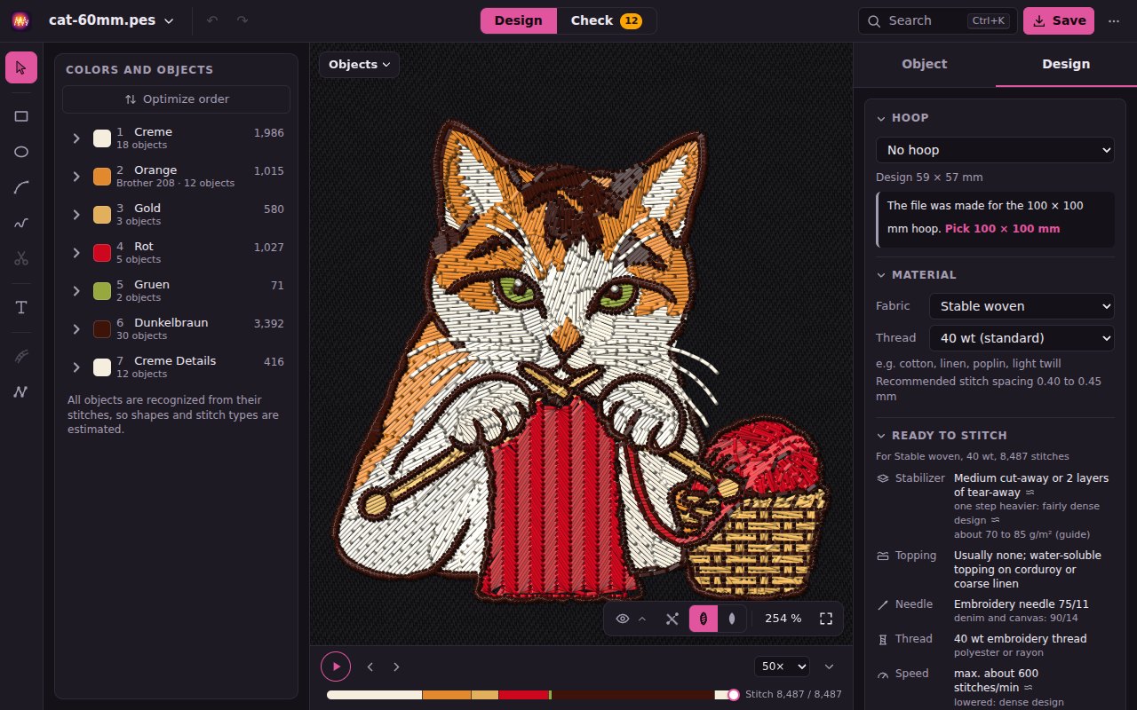 The example cat in Design, fully sewn in the realistic view: the colors with their objects on the left, the player below, the Design card on the right